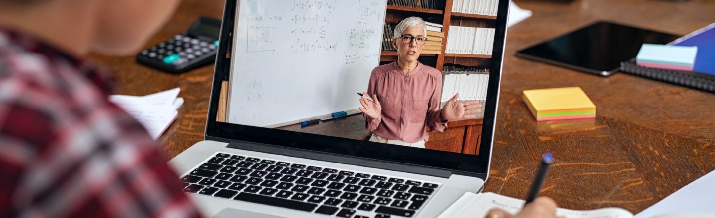 Laptop showing professor giving remote lecture