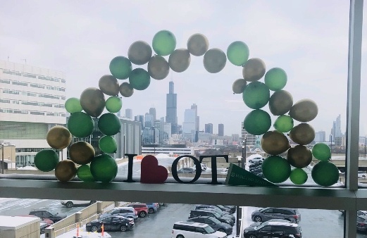 Chicago skyline featured with "I heart OT" balloon arch.