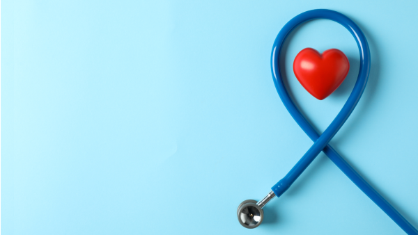 Stethoscope looping around a red heart shape