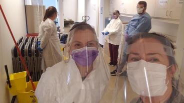 Health care workers wearing face shields