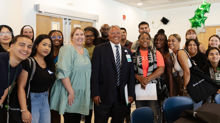 Rush University President Robert S.D. Higgins, MD, MSHA, takes part in a student onboarding fair.